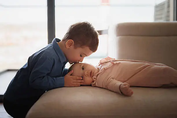 newborntoddlerphoto – Geetha Pokala Toddler sweetly and gently kissing his newborn brother